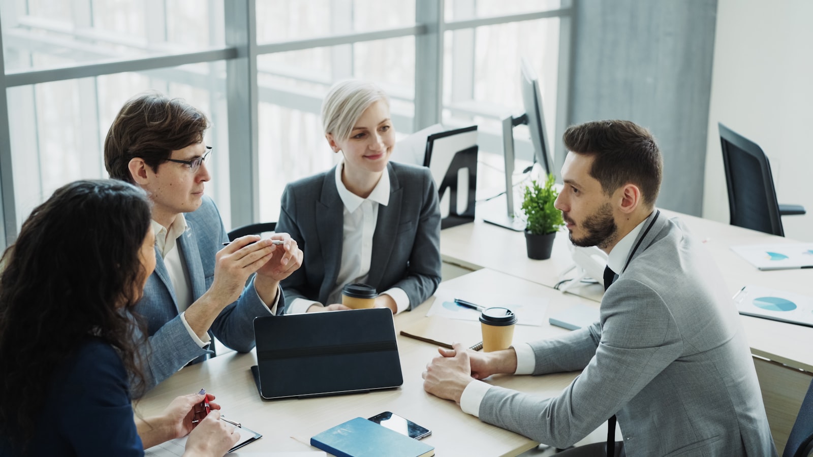 Enterprise team reviewing AI agent workflows together in a modern office